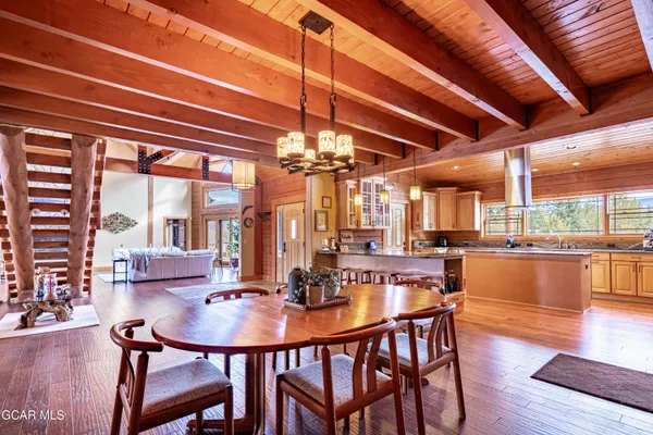 a spacious bedroom with a bed and a flat screen tv