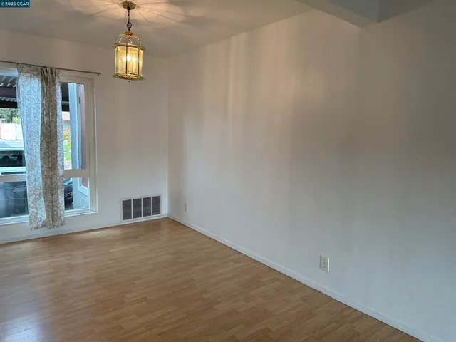 a view of livingroom with hardwood floor and window