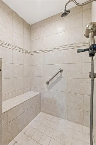 a bathroom with a shower and a bathtub