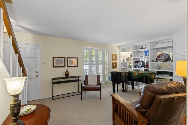 a living room with furniture and a lamp