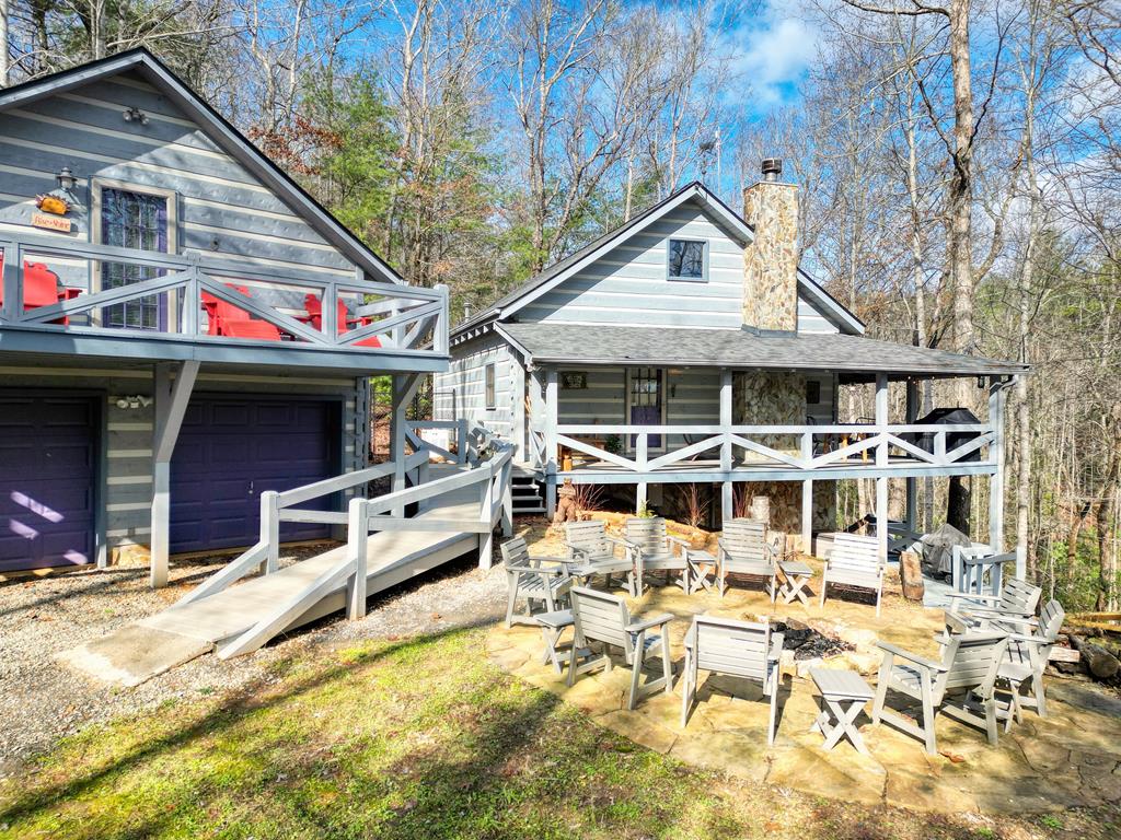 a view of a house with wooden walls and furniture