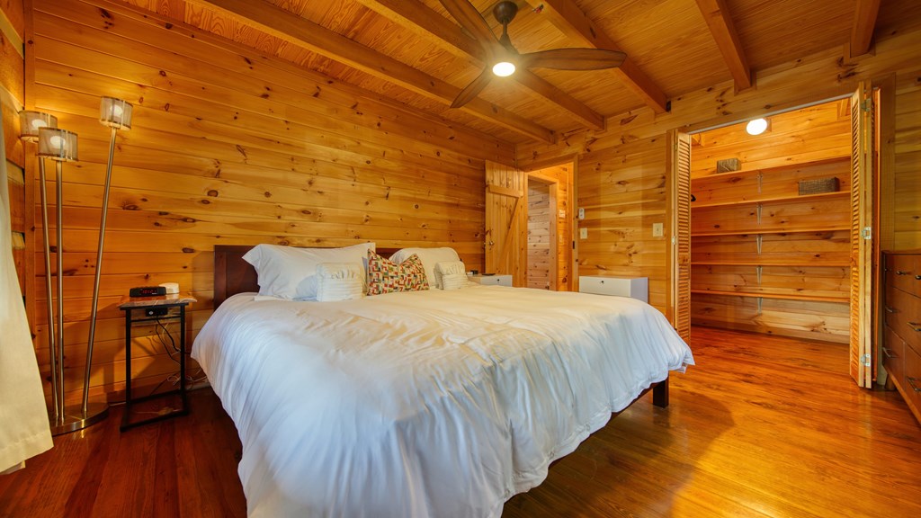 492 Chinkapin Drive Blue Ridge, GA 30513 - Photo 19 of 45 a bed sitting in a bedroom next to a window