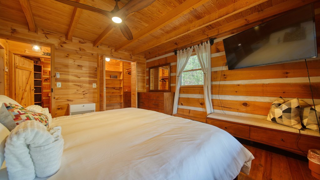 492 Chinkapin Drive Blue Ridge, GA 30513 - Photo 20 of 45 a bedroom with a bed and a walk in closet