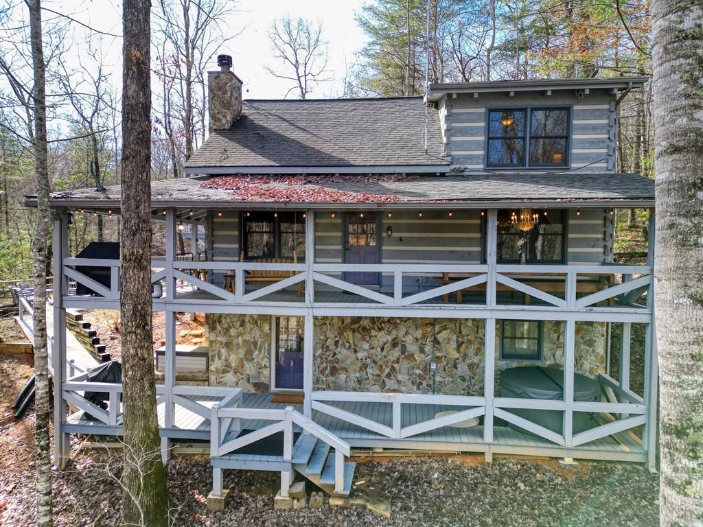 492 Chinkapin Drive Blue Ridge, GA 30513 - Photo 2 of 45 a backyard of a house with table and chairs