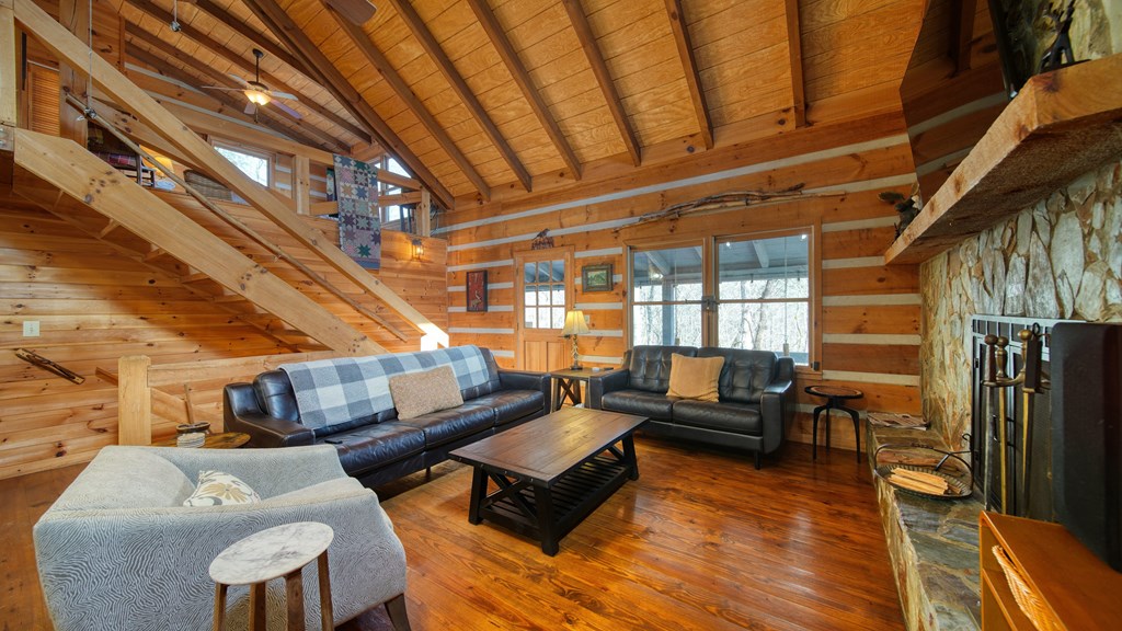 492 Chinkapin Drive Blue Ridge, GA 30513 - Photo 27 of 45 a living room with furniture and a fireplace