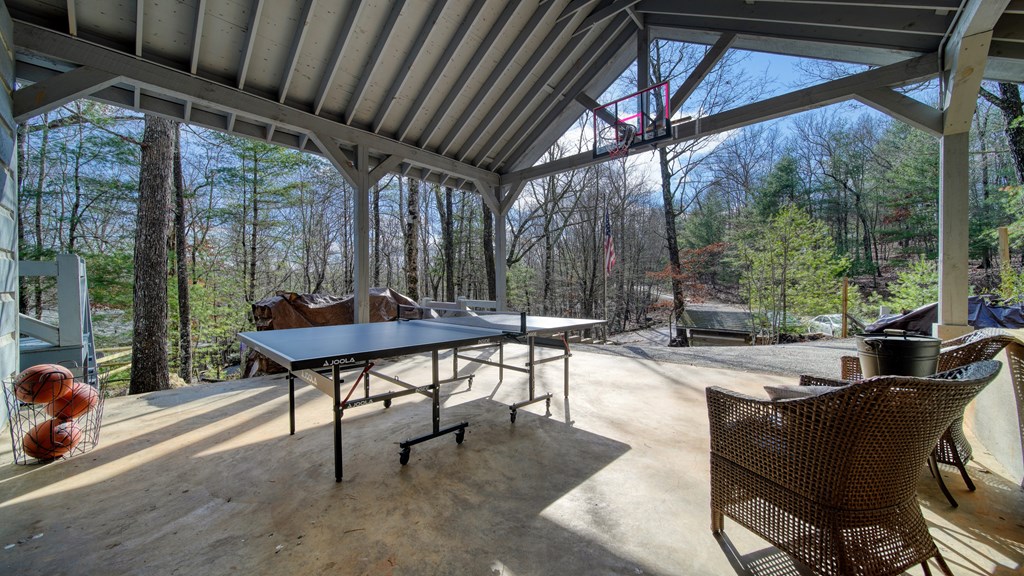 492 Chinkapin Drive Blue Ridge, GA 30513 - Photo 36 of 45 a view of a patio with a table chairs and a grill