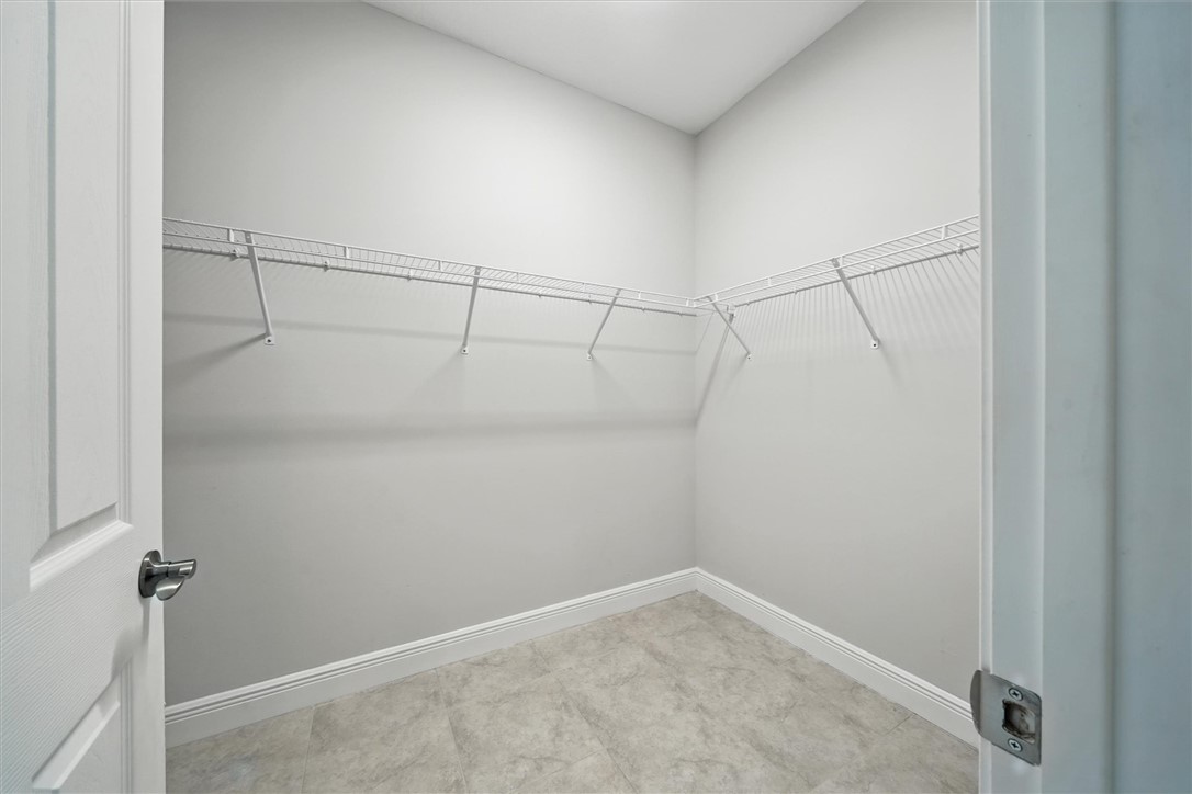 6096 Bella Rosa Lane Vero Beach, FL 32966 - Photo 13 of 33 a view of a room with racks on the wall