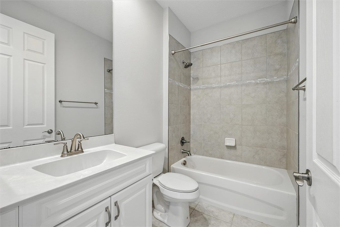 6096 Bella Rosa Lane Vero Beach, FL 32966 - Photo 16 of 33 a bathroom with a sink toilet and shower