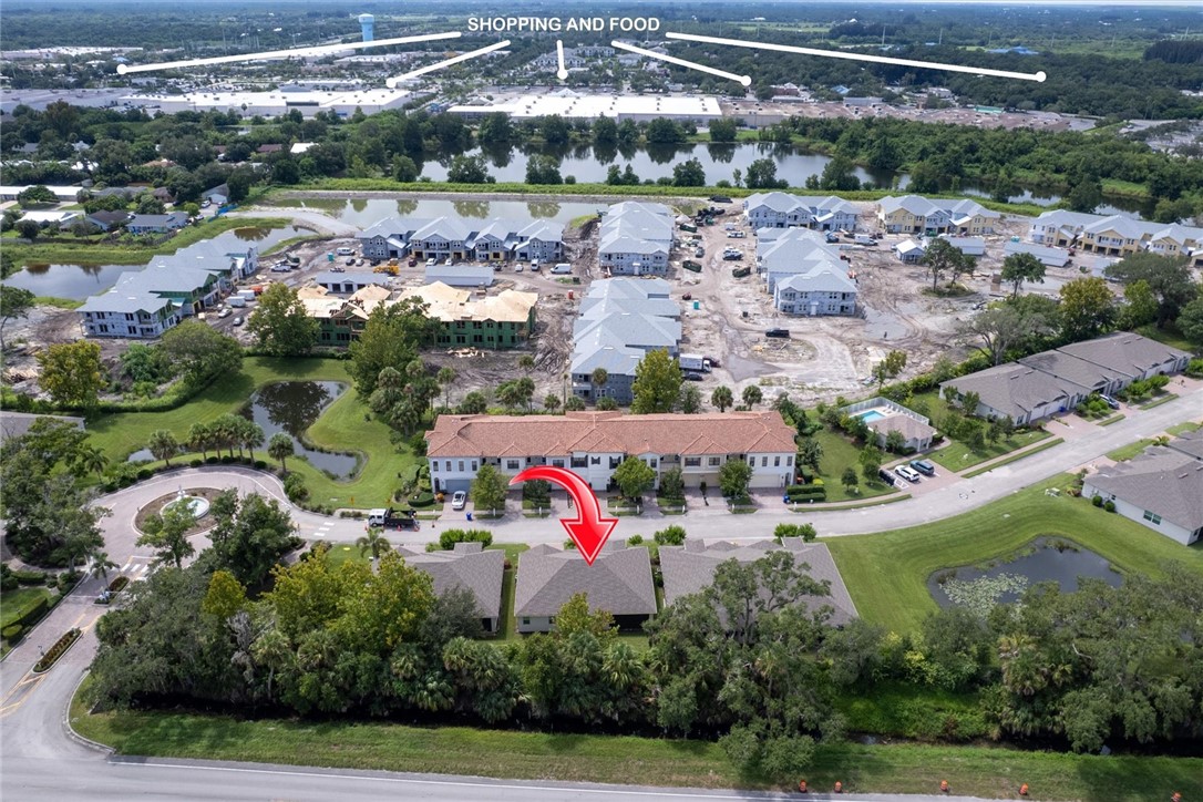6096 Bella Rosa Lane Vero Beach, FL 32966 - Photo 29 of 33 an aerial view of house with yard and swimming pool