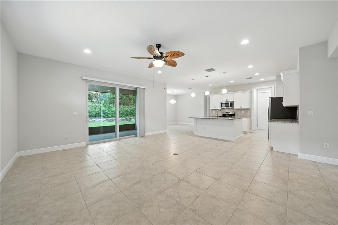 6096 Bella Rosa Lane Vero Beach, FL 32966 - Photo 3 of 33 a view of a kitchen with a sink and a window