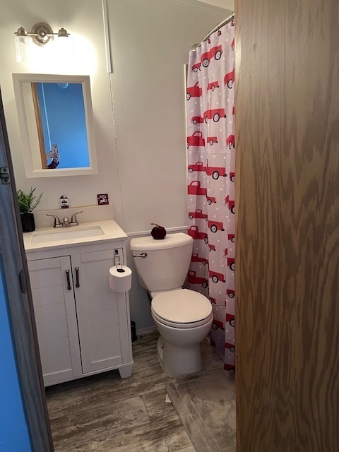 2795 East 28th Road Marseilles, IL 61341 - Photo 18 of 62 a bathroom with a toilet sink vanity and mirror