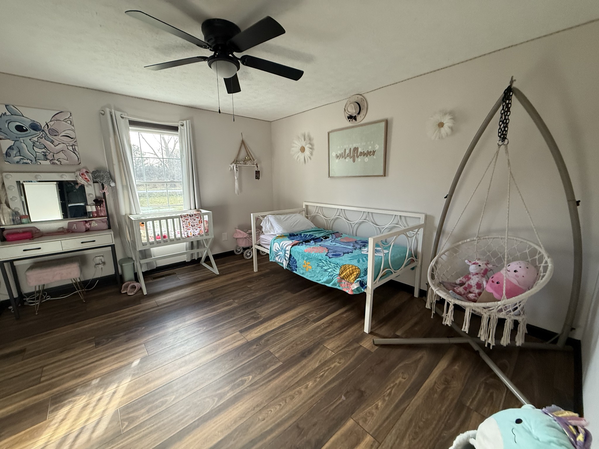 108 Checker Lane Lafayette, TN 37083 - Photo 11 of 15 a bedroom with bed and a chandelier