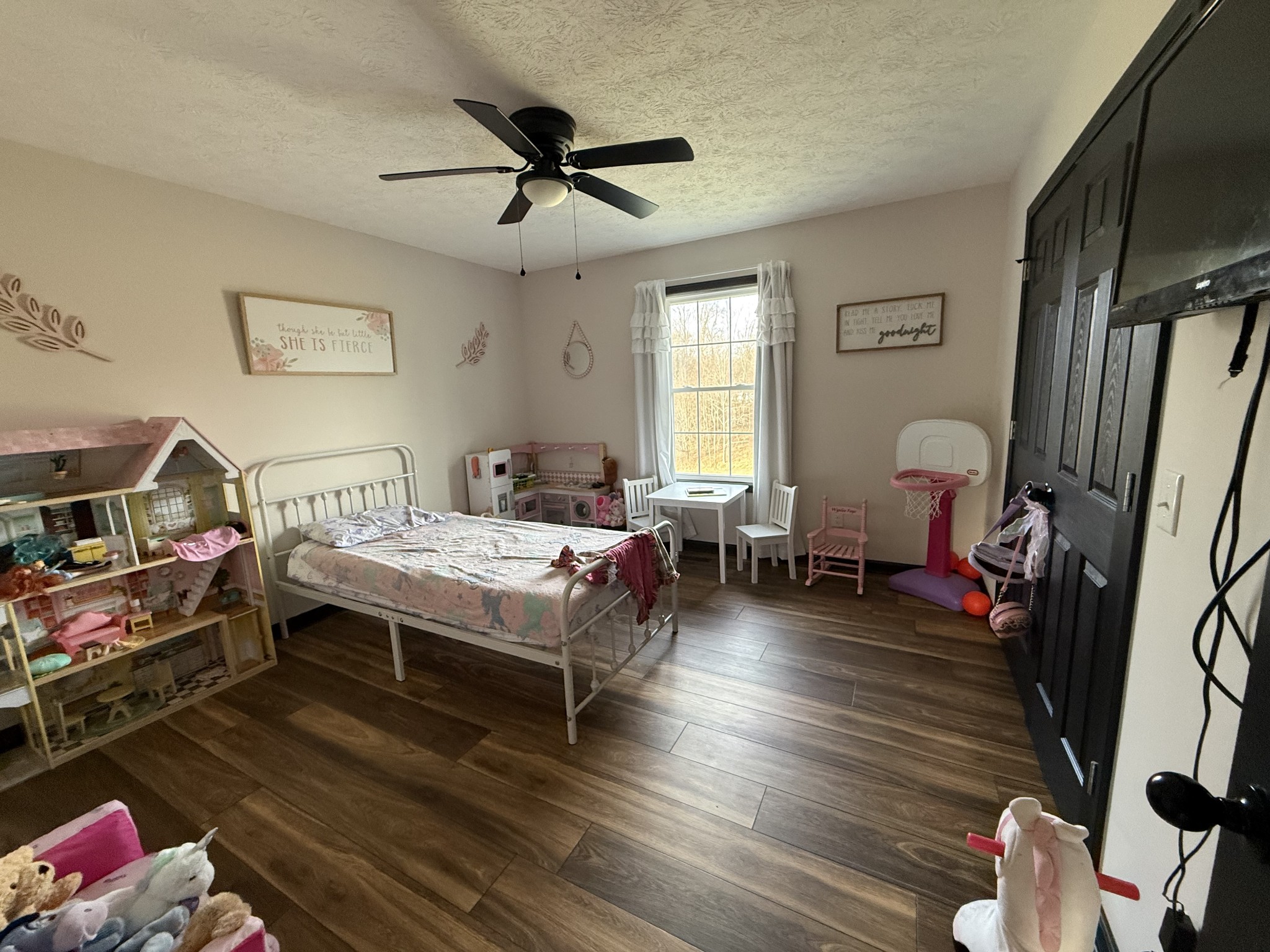 108 Checker Lane Lafayette, TN 37083 - Photo 13 of 15 a bedroom with furniture and a window