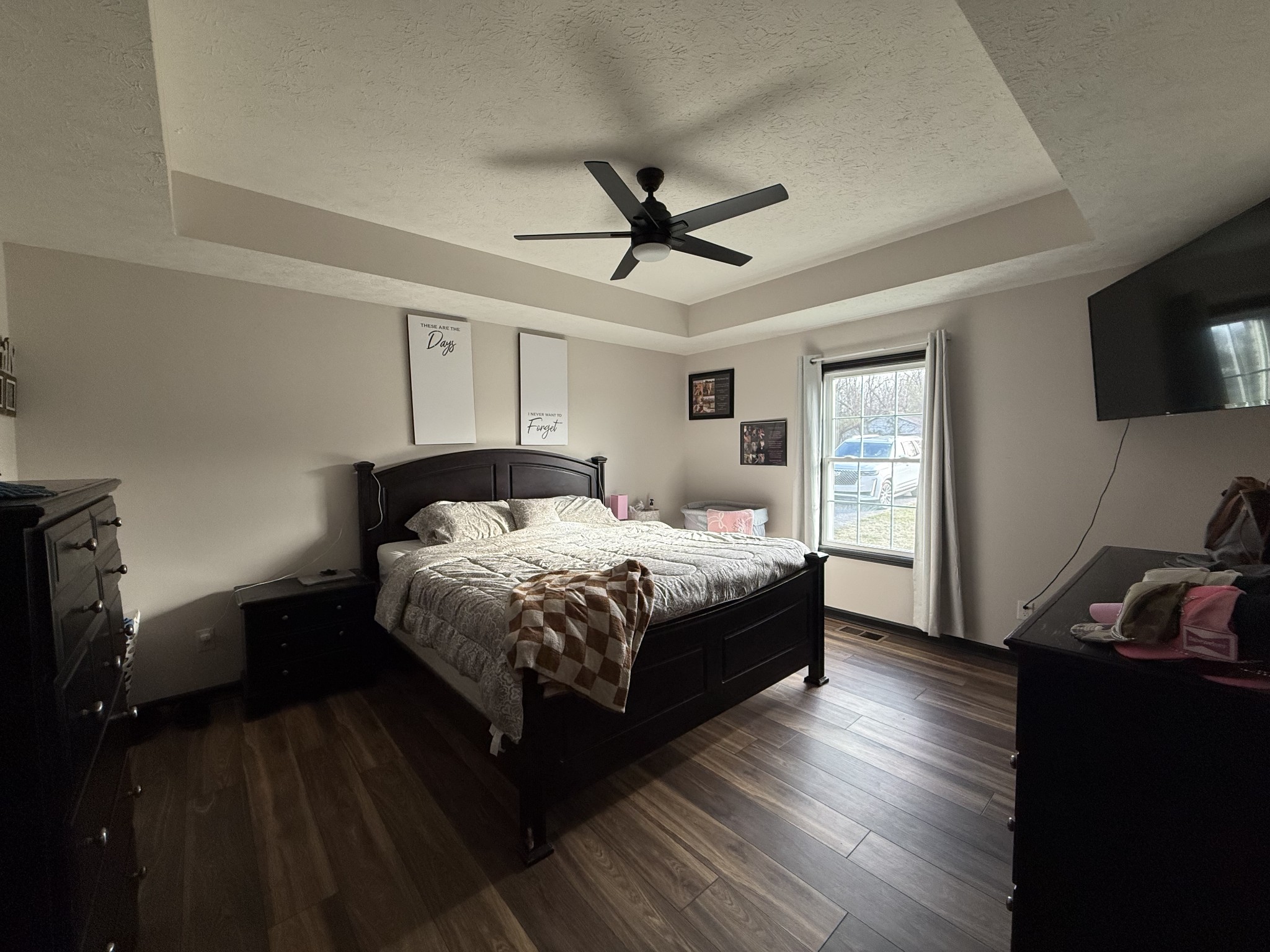 108 Checker Lane Lafayette, TN 37083 - Photo 9 of 15 a bedroom with a bed and a flat tv screen on the dresser