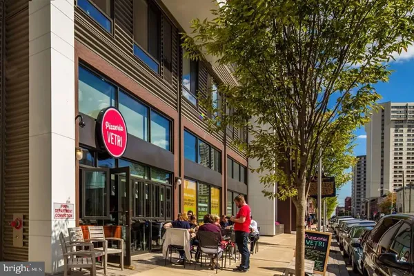 a street sign in a city with tall buildings