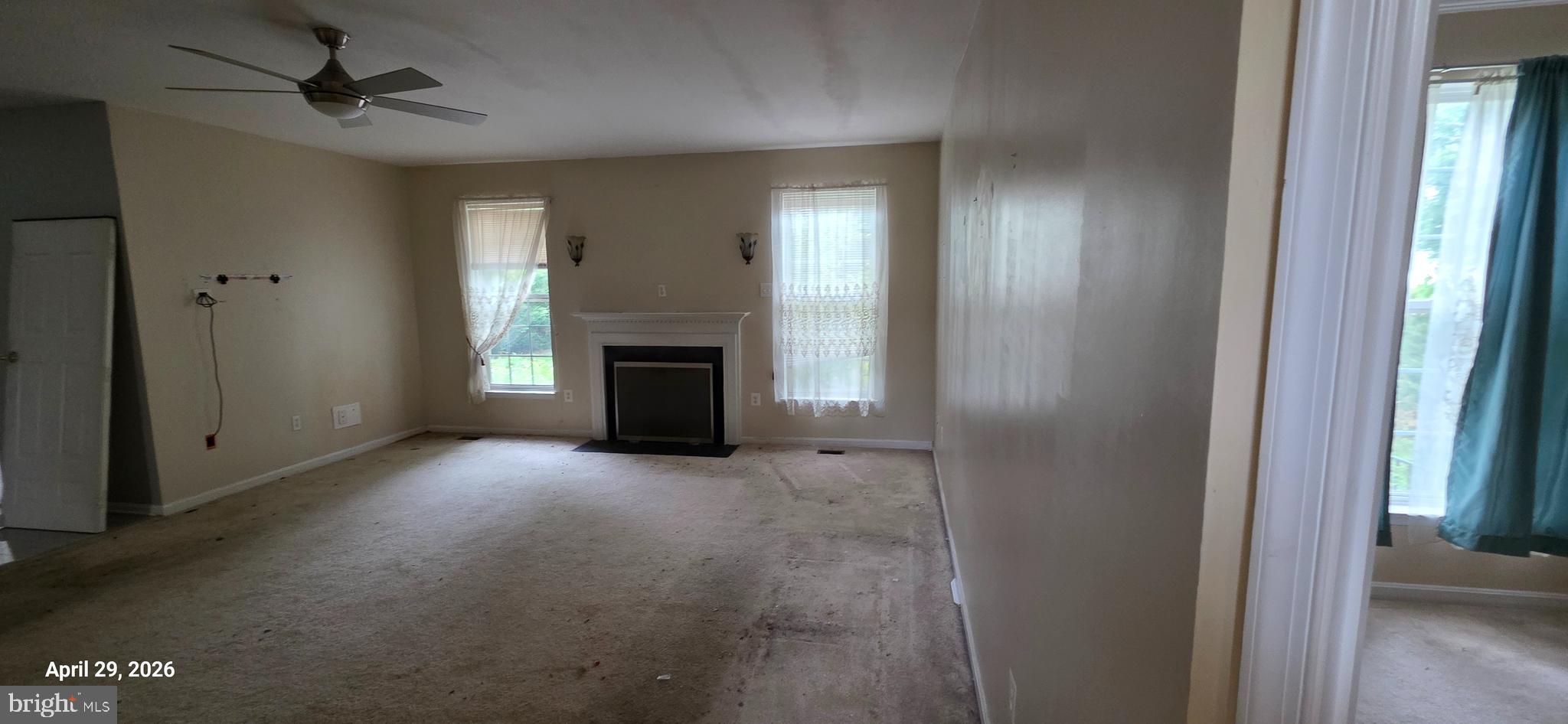 106 Sunlight Drive Frederick, MD 21702 - Photo 13 of 38 a view of empty room with fireplace and fan