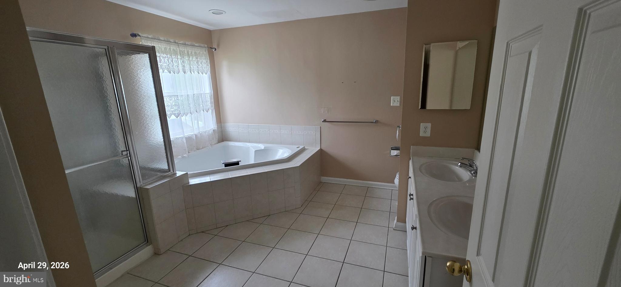 106 Sunlight Drive Frederick, MD 21702 - Photo 2 of 38 a bathroom with a tub and shower