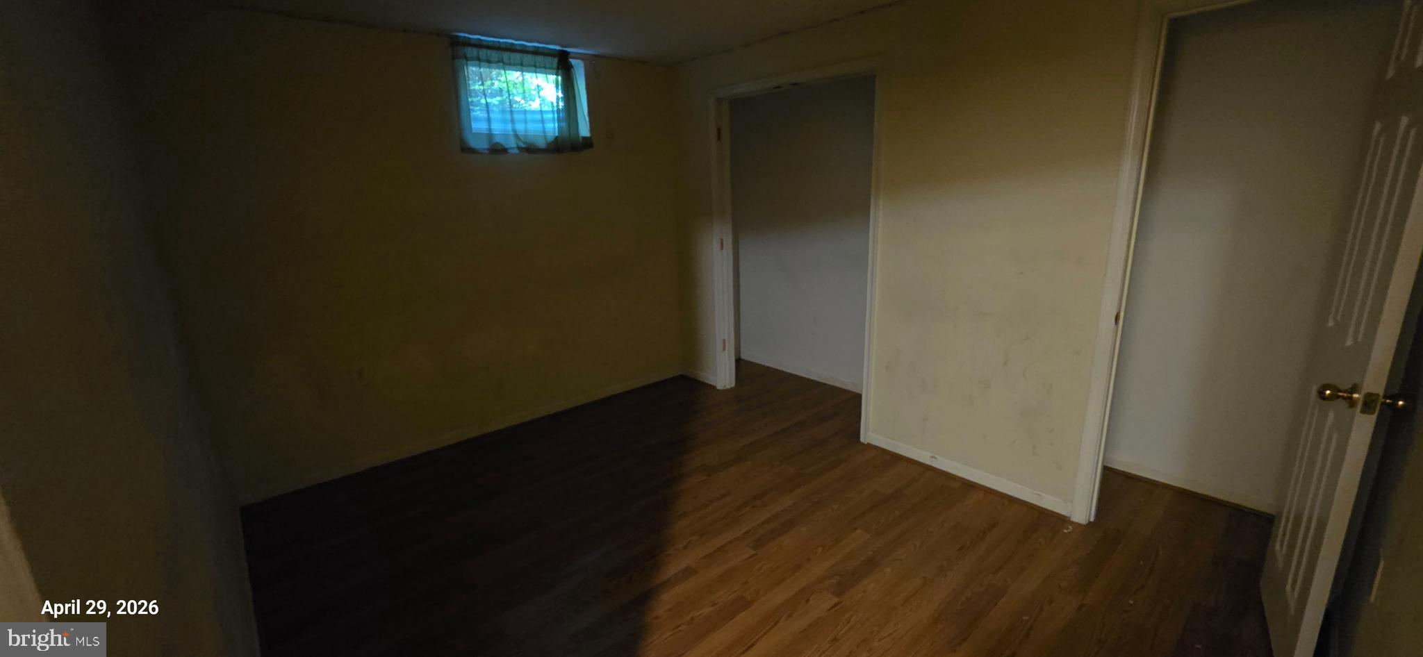 106 Sunlight Drive Frederick, MD 21702 - Photo 23 of 38 a view of an empty room with wooden floor and a window