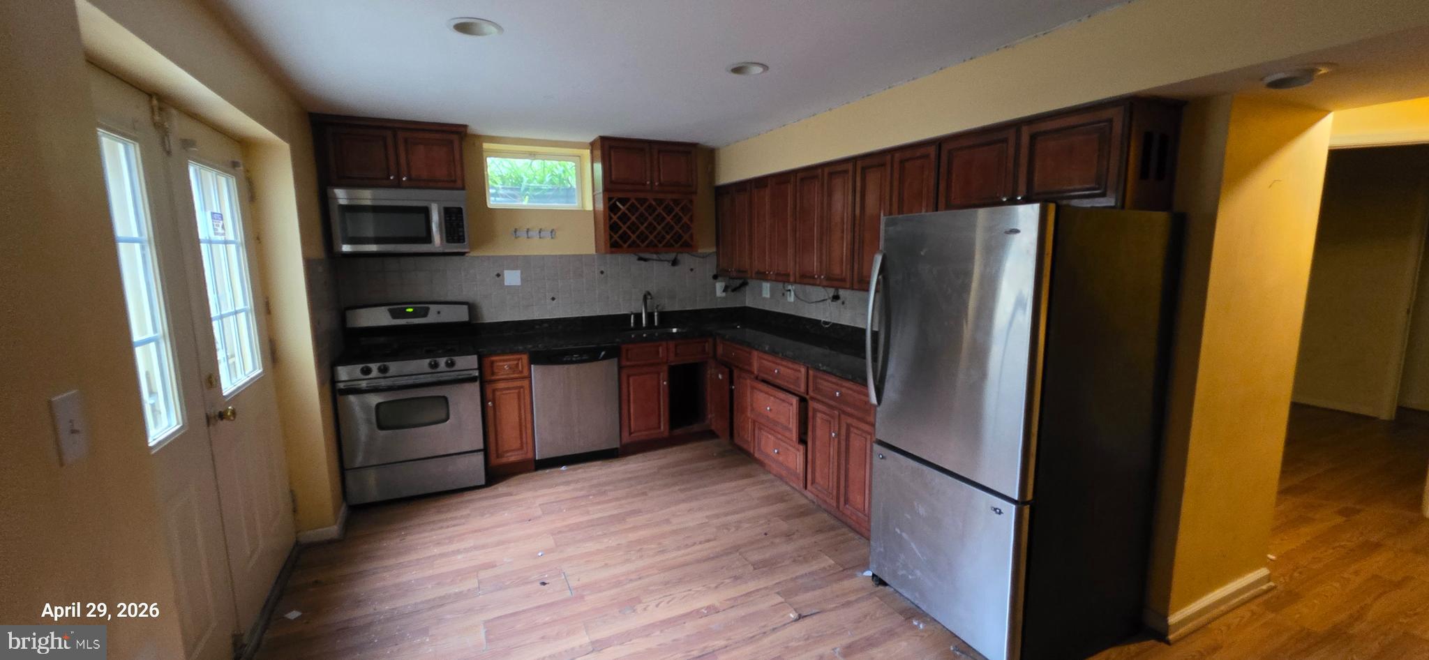 106 Sunlight Drive Frederick, MD 21702 - Photo 24 of 38 a kitchen with stainless steel appliances granite countertop a refrigerator and a stove top oven
