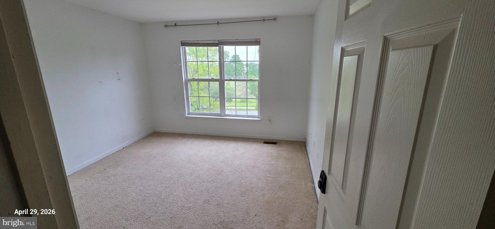 106 Sunlight Drive Frederick, MD 21702 - Photo 4 of 38 an empty room with a window