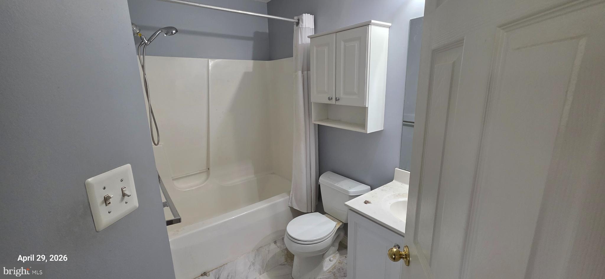 106 Sunlight Drive Frederick, MD 21702 - Photo 7 of 38 a white toilet sitting next to a bathroom sink
