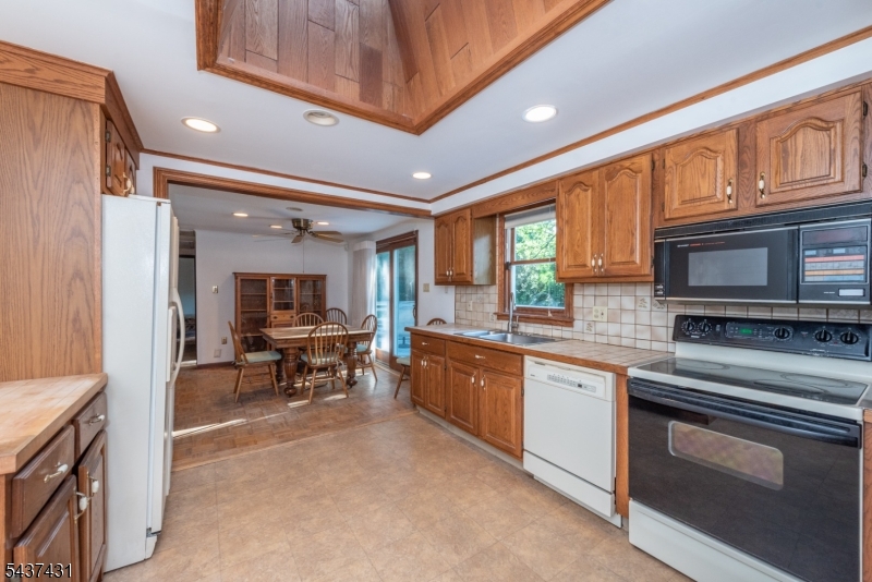20 Wanaque Road West Milford, NJ 07421 - Photo 6 of 31 a kitchen with stainless steel appliances granite countertop sink stove and refrigerator