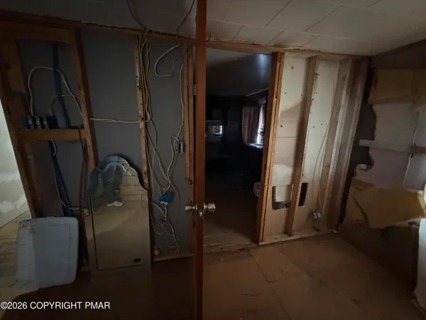 a kitchen with a refrigerator and a stove top oven