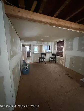 a view of a kitchen with a sink a refrigerator and window
