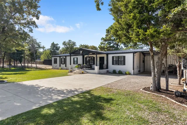 a house with swimming pool in front of it