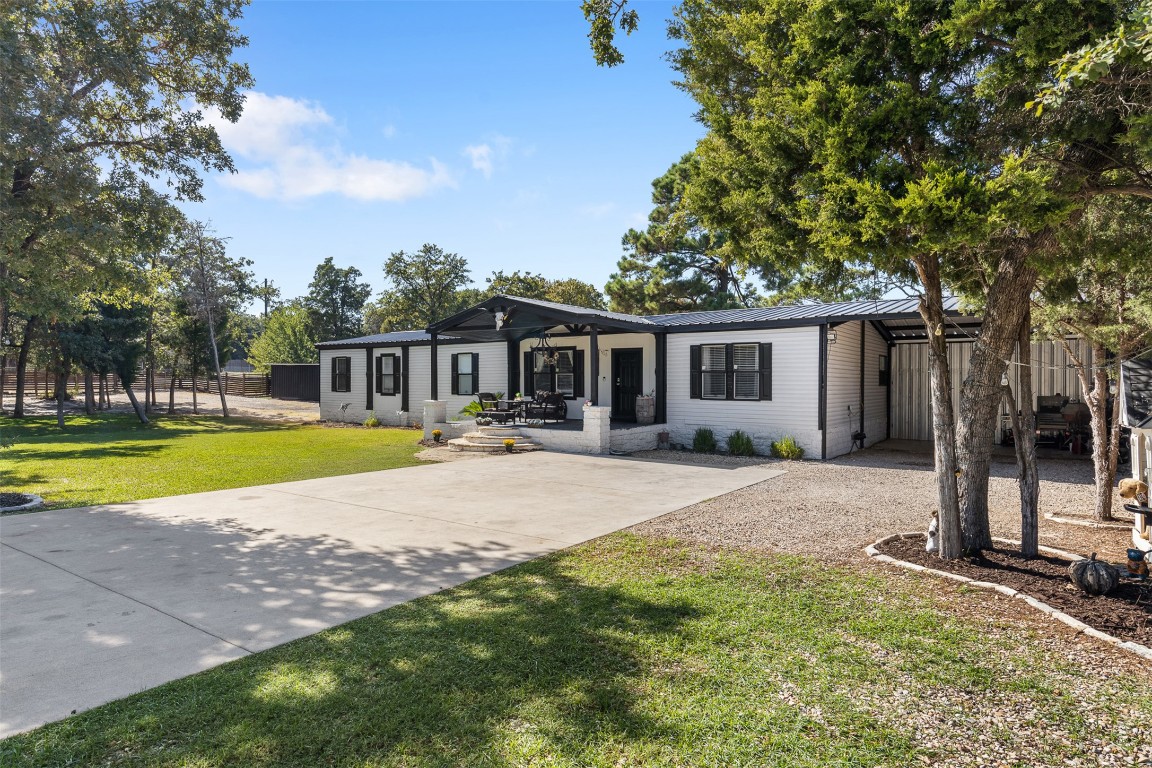 a house with swimming pool in front of it