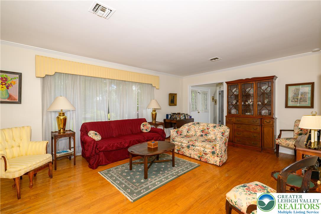 2516 Rachael Lane Orefield, PA 18069 - Photo 13 of 45 Hardwood floors and generous windows fill this spacious living area with natural light, perfect for entertaining.