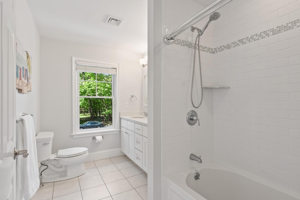 56 Old Marlboro Road Concord, MA 01742 - Photo 16 of 34 a bathroom with a granite countertop toilet a sink and shower
