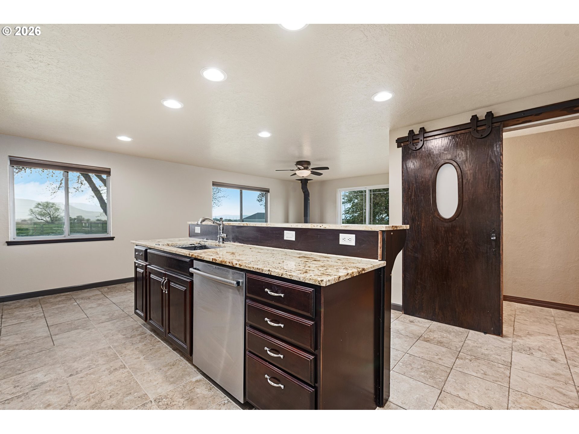 58015 Godley Road Union, OR 97883 - Photo 7 of 44 a kitchen with granite countertop a sink and a stove
