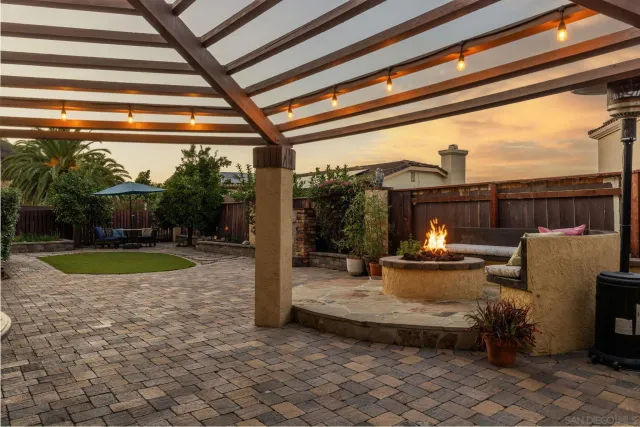a view of a chair and tables in the patio