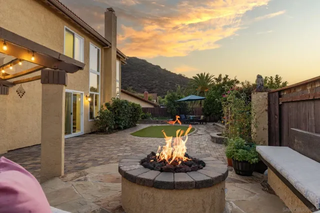 a view of a house with a bath tub and a fire pit