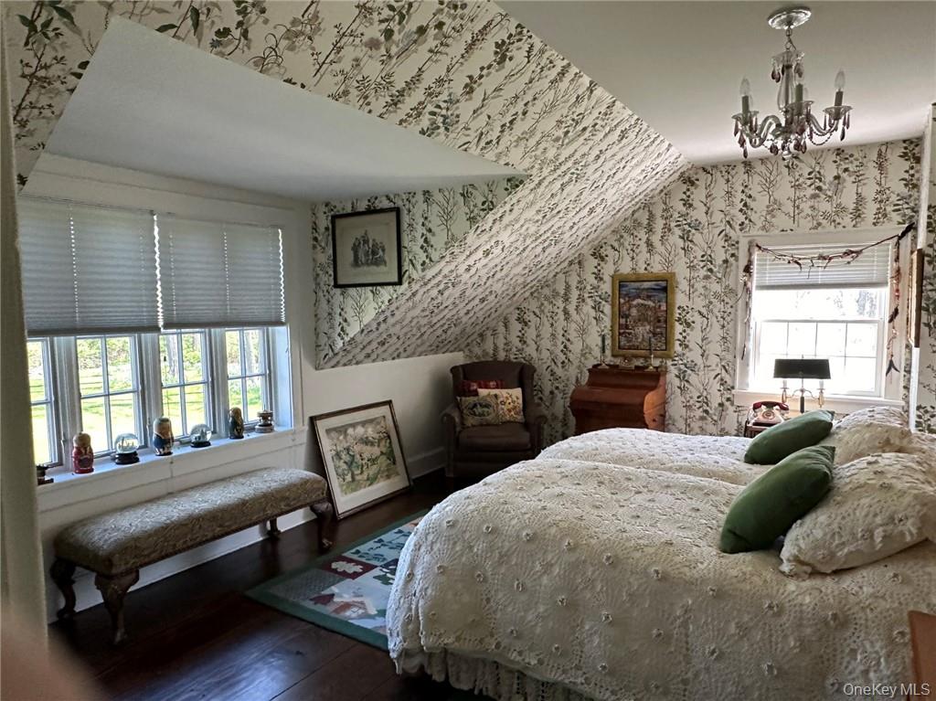 477 Canoe Hill Road Millbrook, NY 12545 - Photo 10 of 11 Bedroom with hardwood / wood-style floors, a chandelier, and multiple windows