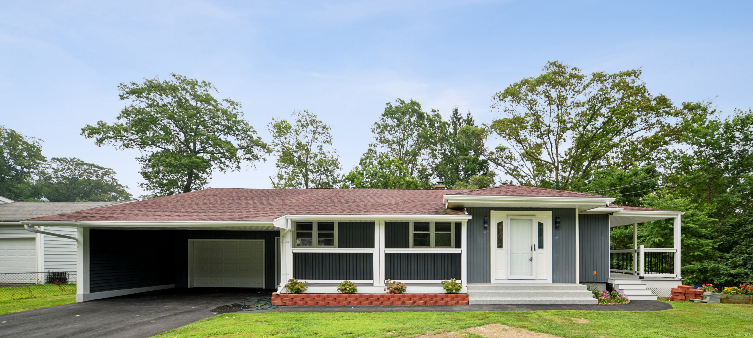 a front view of a house with a garden