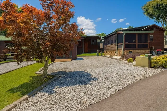 a view of a balcony with two chairs