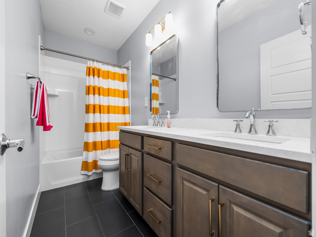 877 South Yarrow Drive Mapleton, UT 84664 - Photo 21 of 46 Bathroom featuring a single vanity with a white countertop, chrome faucet, and rectangular mirror