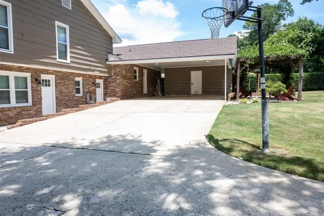 a view of a white house with a outdoor space