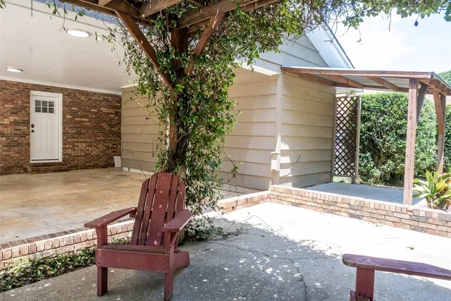 a view of a backyard with chairs