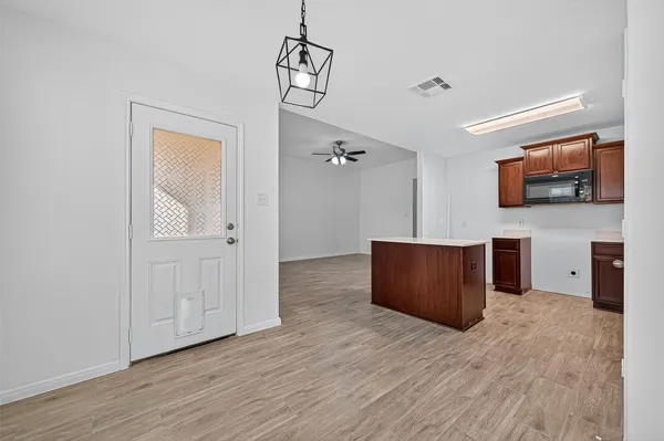 a view of a livingroom with furniture and wooden floor