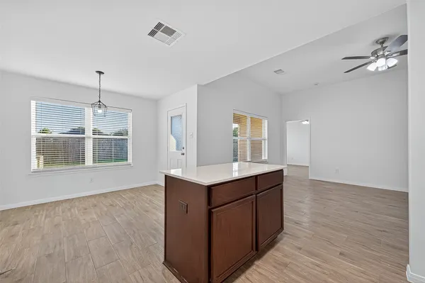 a view of a kitchen with a sink and cabinet