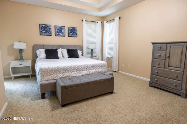 a room with a bed and furniture