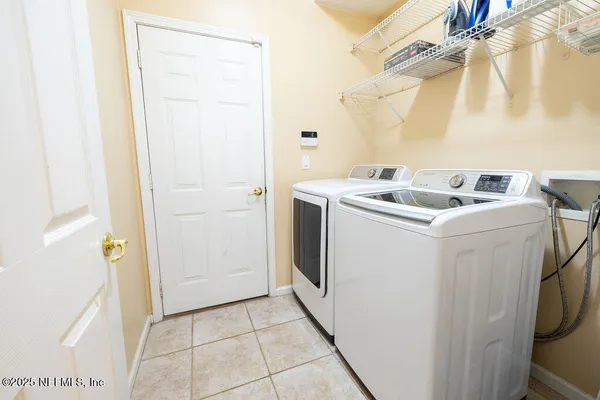 a utility room with dryer and washer