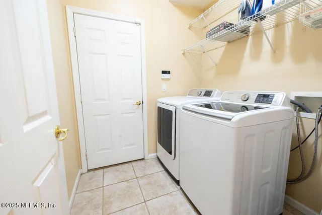 a utility room with dryer and washer