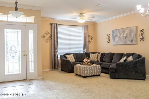 a living room with furniture and a window