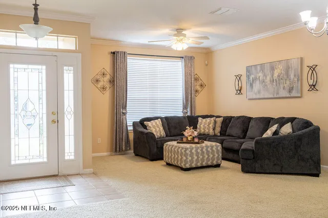 a living room with furniture and a window