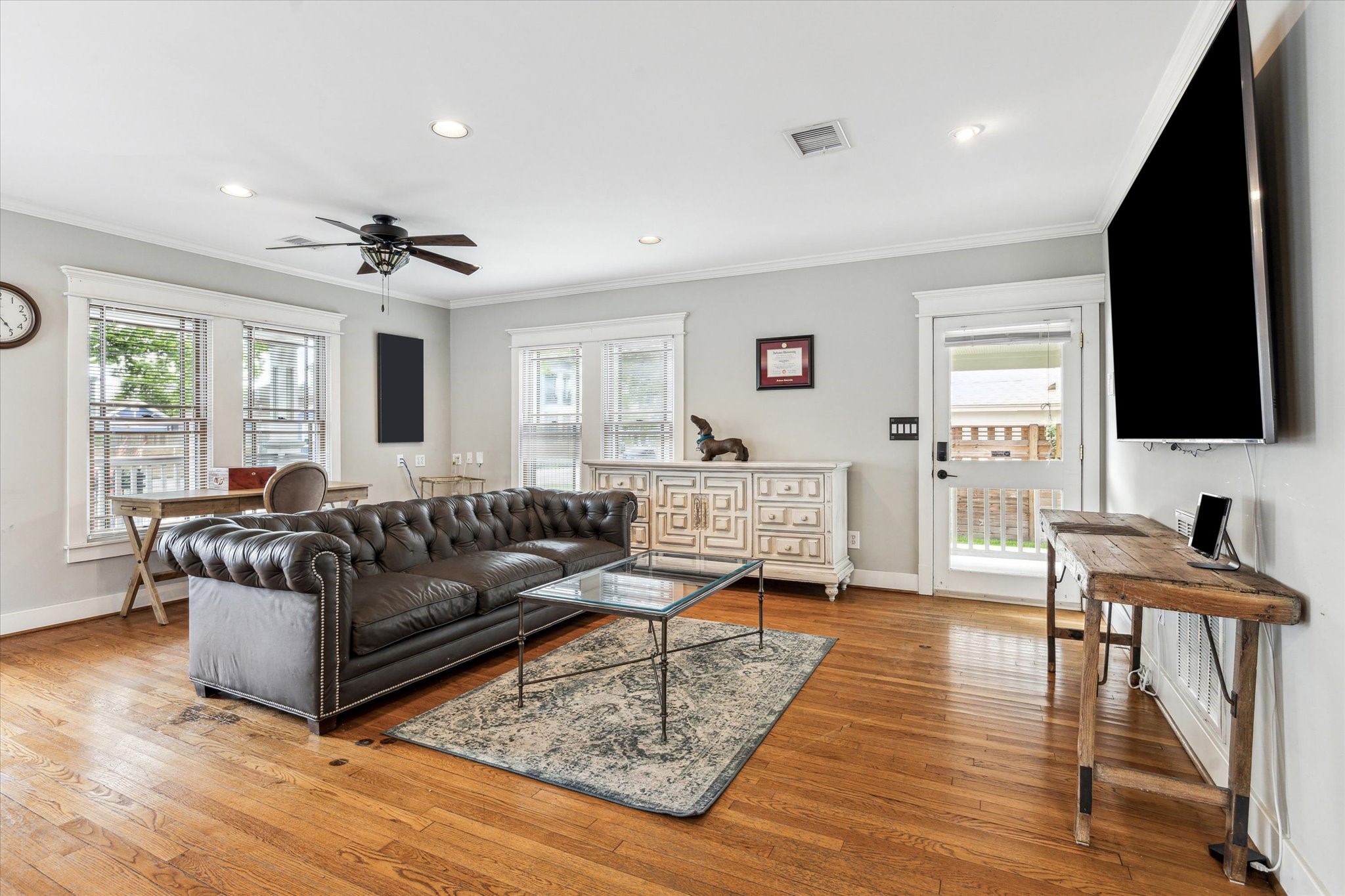1321 West 21st Street Houston, TX 77008 - Photo 12 of 31 Large windows and direct outdoor access create a bright, open feel with seamless indoor-outdoor flow.