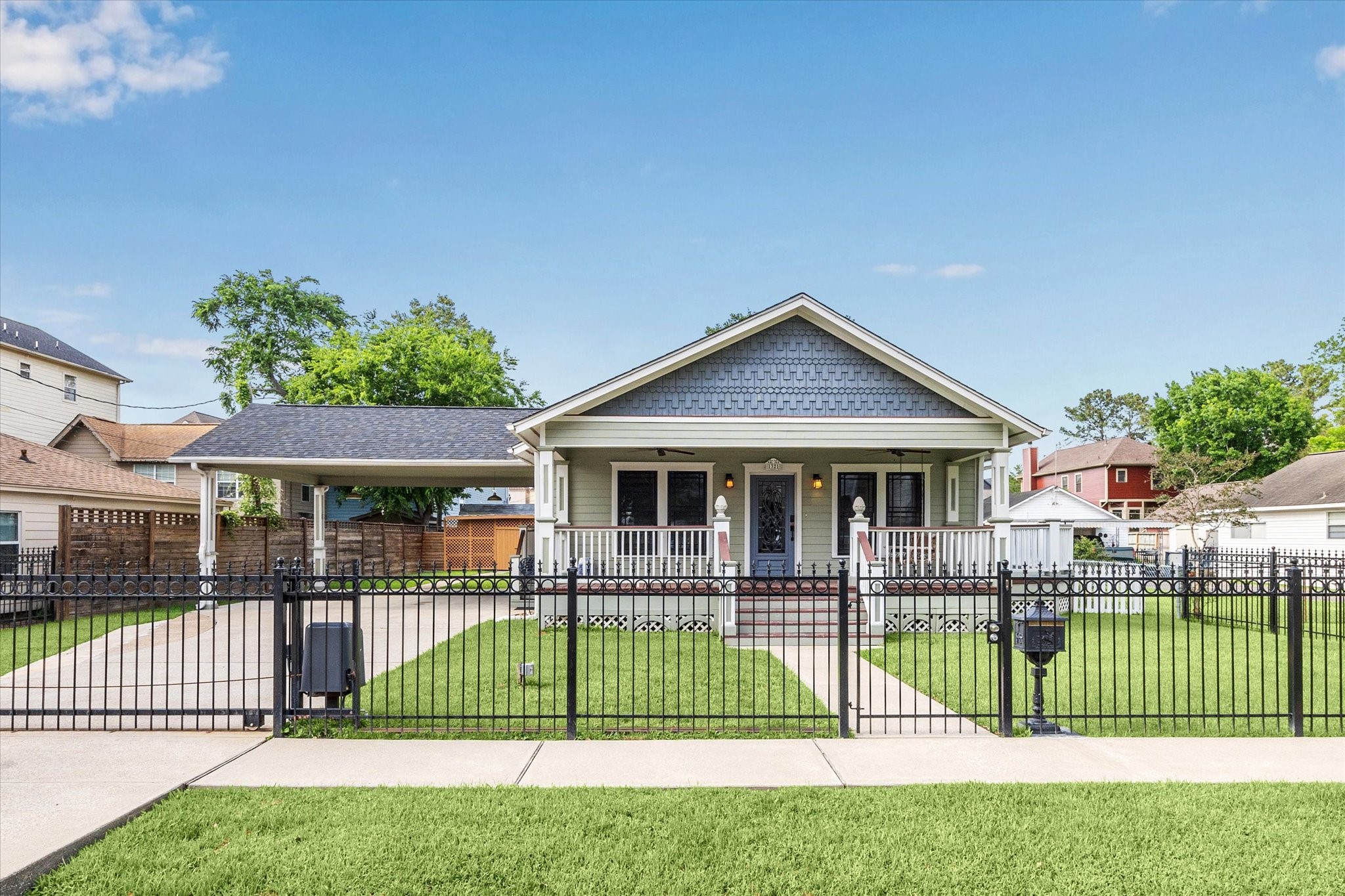 1321 West 21st Street Houston, TX 77008 - Photo 4 of 31 Gated front entry with wrought-iron fencing enhances security and curb appeal. Pedestal Mailbox for your incoming mail. Sidewalk offers your guest a welcoming experiences before entering your home.